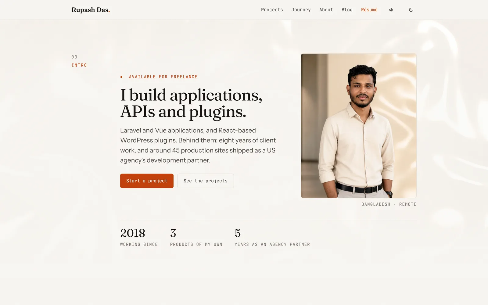 The homepage of devrupash.com, showing the intro section with headline, portrait and the stat row